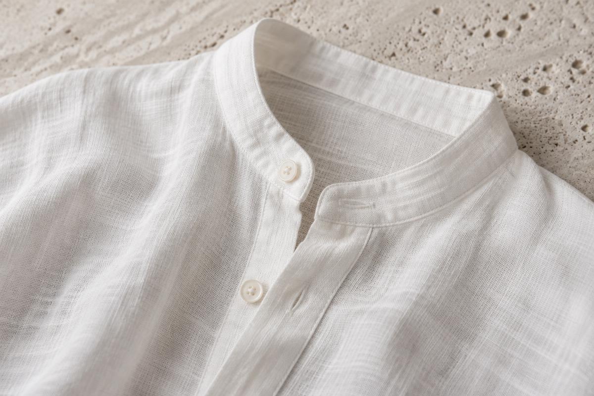 Close-up of a breathable white linen band-collar shirt