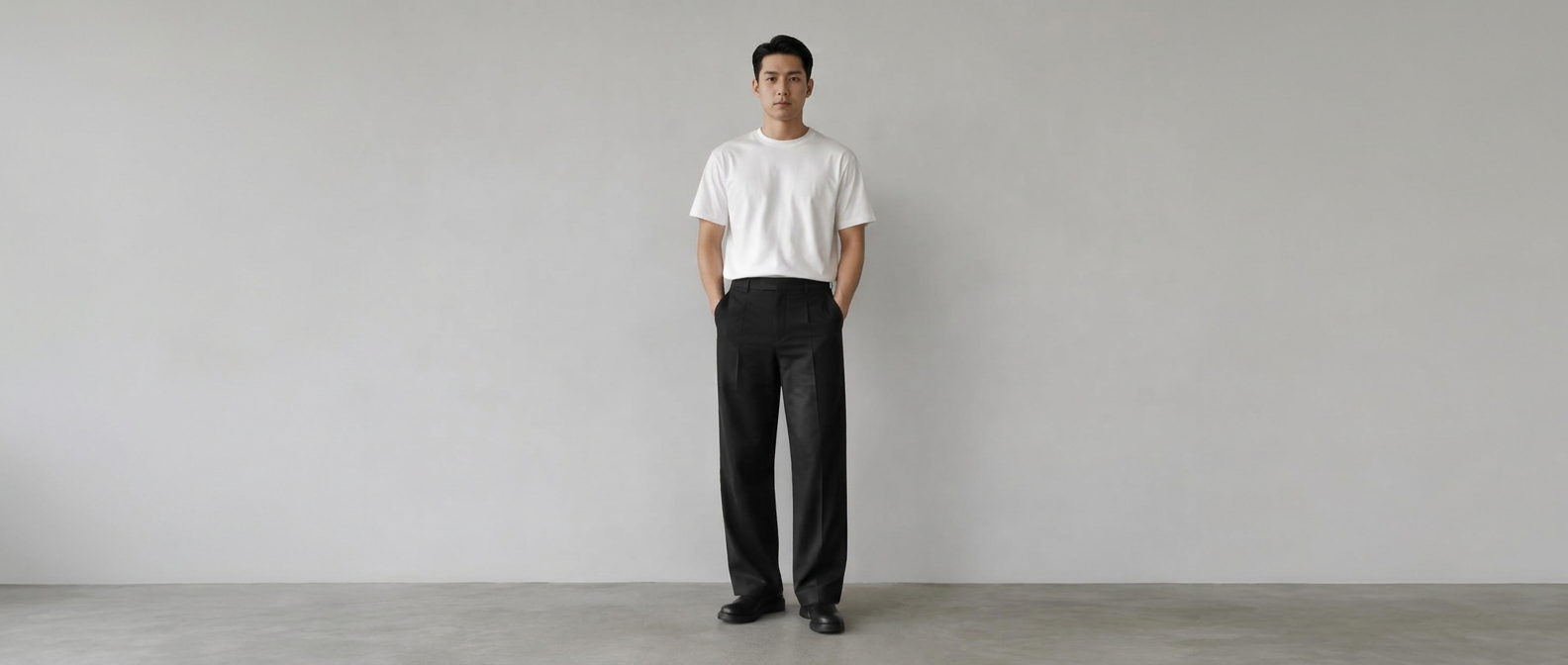 A plain white t-shirt worn with straight wide black trousers