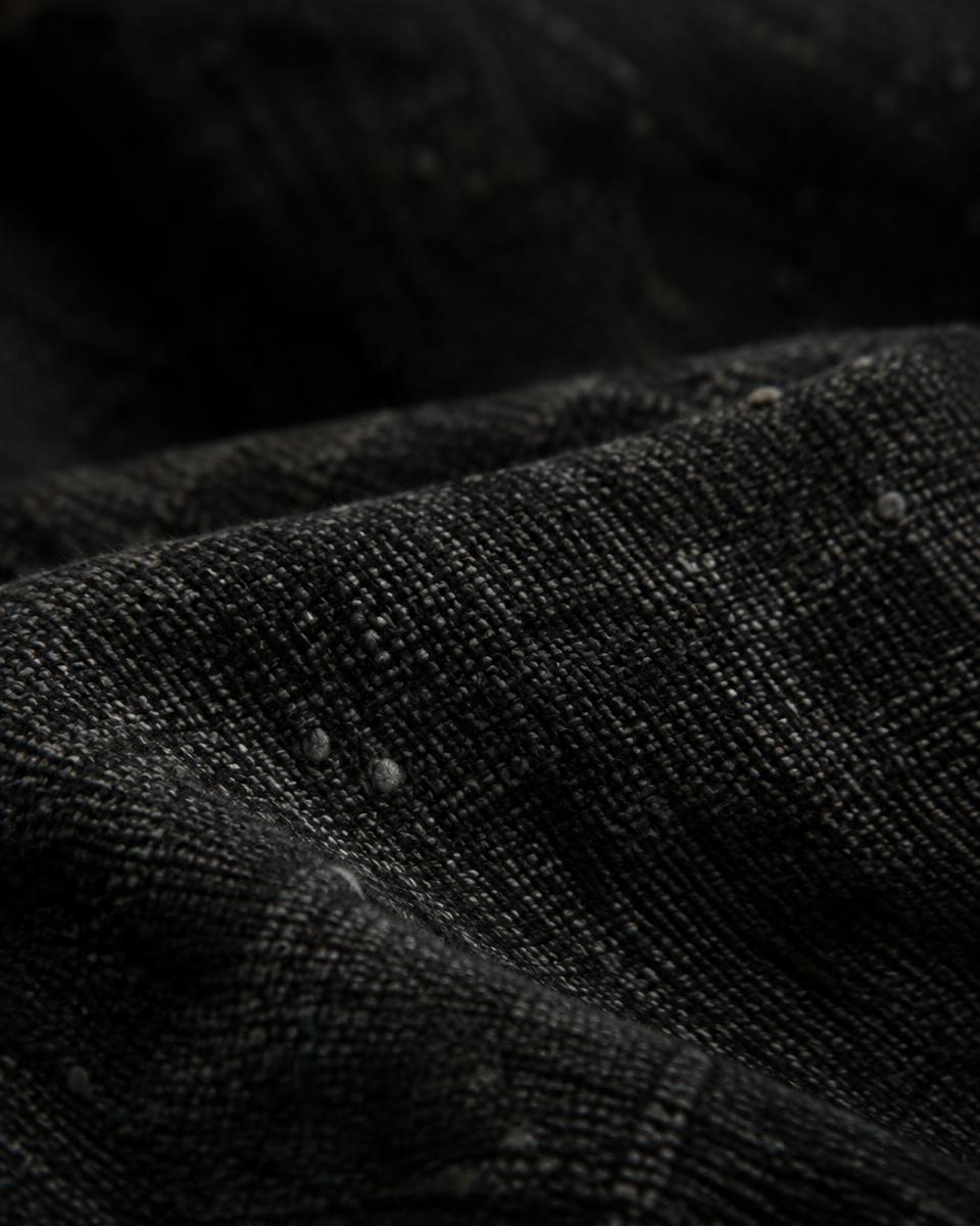 Close-up of dark linen weave with natural slubs